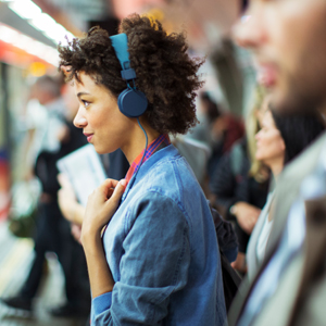 The Source women wearing headphones
