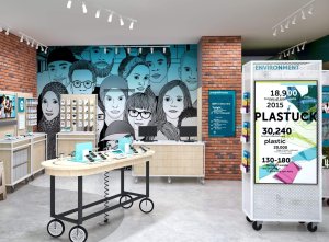 An image of a store interior featuring a large mural on the wall, a display case with various items, and a counter with a sign that reads "SERIA".