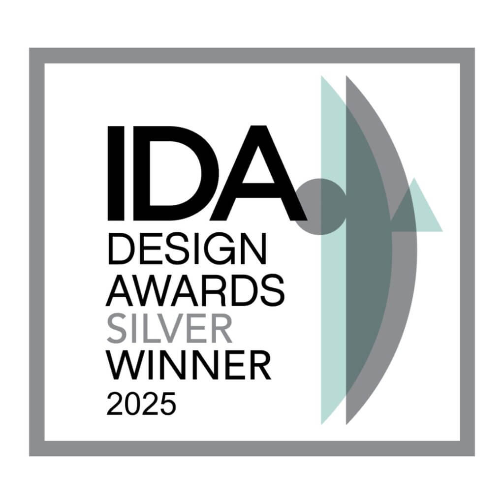 A logo for the Ida Design Awards. It features a silver trophy with a blue ribbon, a white background, and text that reads "IDA Design Awards…